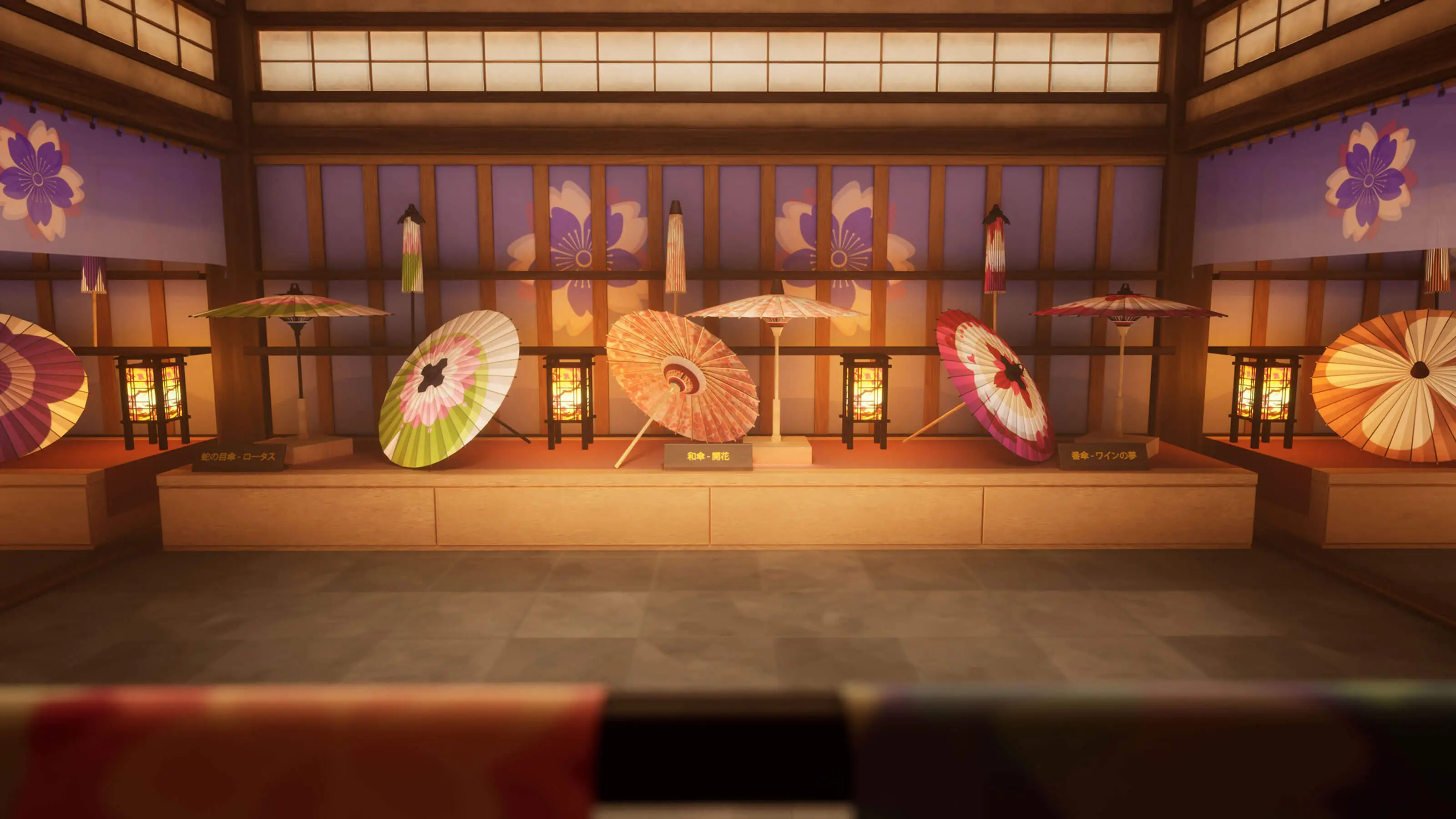 Ornate Japanese fans sit atop a small shelf as decorations