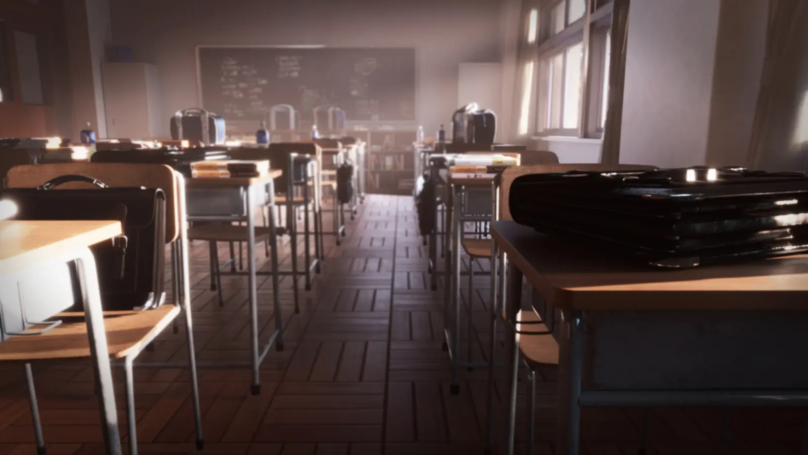 A row of desks in an empty classroom.