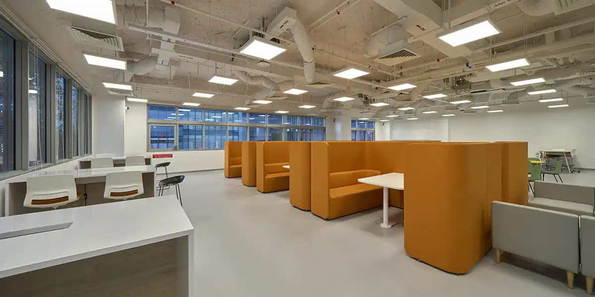 Interior view of a campus studio seating area.